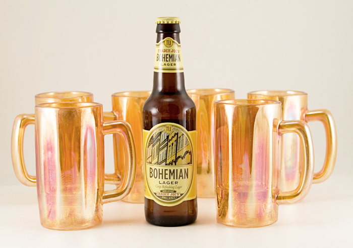 Thick-walled molded glass has straw marks from old-fashioned cooling methods.