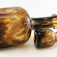 Decorated with mottled brown glass to give the tortoise shell effect.