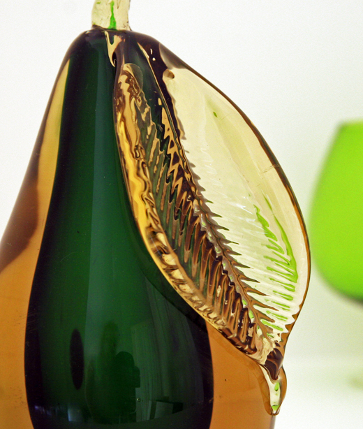 Handblown in a honey amber encasing a deep emerald green.