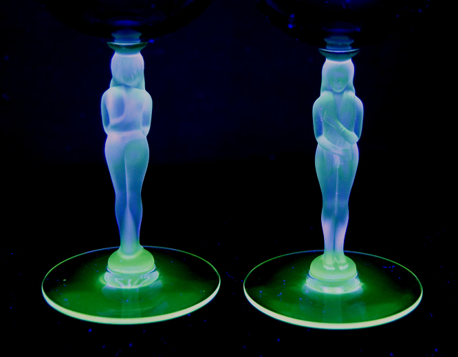 The clear glass reflects green under blacklight indicating old age.