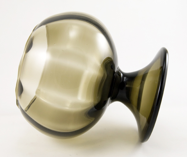 Blown smoke black glass with optic panels and an unusual domed inverted foot.