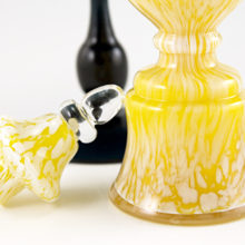 The stopper was blown in two parts, with the upper finial applied. Well made by a skilled glass artist.