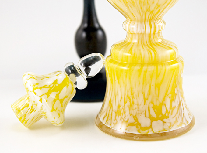 The stopper was blown in two parts, with the upper finial applied. Well made by a skilled glass artist.