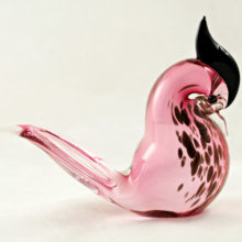 Resting pigeon-like bird in solid glass with copper aventurine.