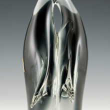 Made of solid glass, blown in sommerso with black interior and colorless exterior.