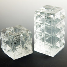 Scarce block candlestick holders in the Diamond pattern.
