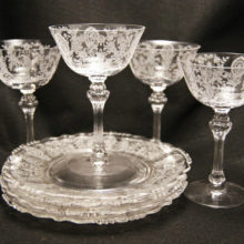 Set of elegant depression glass stems and matching plates.