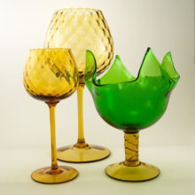 Hand-blown with ruffled rims, applied stem and applied inverted base with a half ball knop finished pontil.
