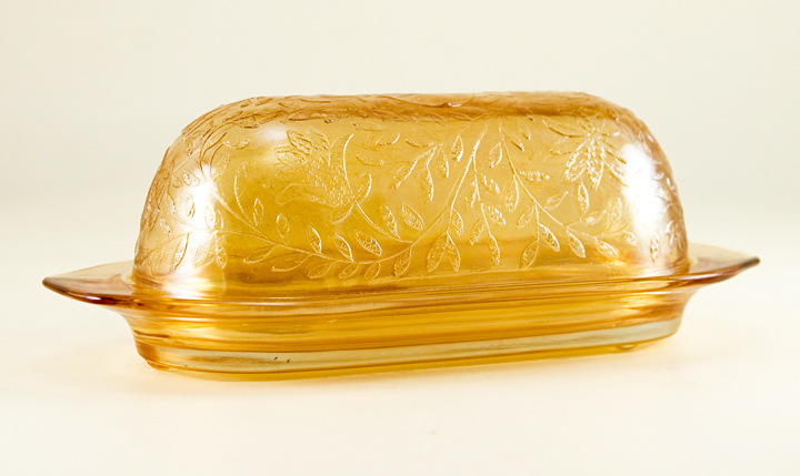 Beautiful 1/4 lb butter dish and cover in Floragold (gold iridescent finish) Louisa (intricate pattern of vines and leaves).