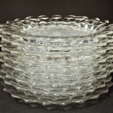 Set of eight 8" Fostoria Glass plates.