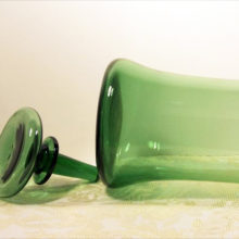 Hand blown, has a few bubble inclusions, expected. Blown stopper is hollow with a solid stem.