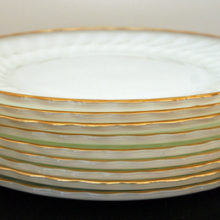 These vintage shell dinner plates were produced by Anchor Hocking in the pattern Suburbia between 1956 & 1976.