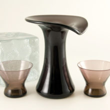 Vintage retro modern black grape colored glass carafe can double as a vase.