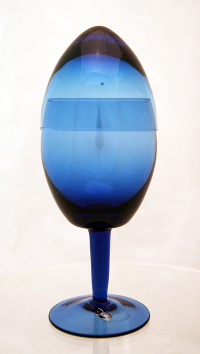Mid-century modernist egg-shaped Pokal. This strange and beautiful wine glass is made of blue blown crystal and sports a cover to keep unwanted elements out.