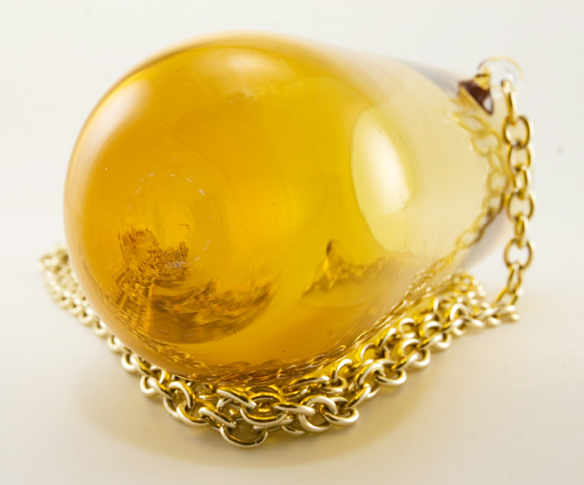 Drink while you dance with this rock and roll tumbler necklace.