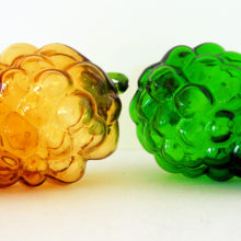 Pair of large hollow blown art glass grapes with applied hand tooled leaf.
