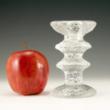 The Festivo candlesticks are still produced today by Iittala and come in a taller and shorter sizes.