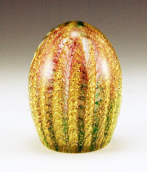Richly laden with spiraling ribs of gold flake and mimicking wisps of green and pink verde behind the gold.