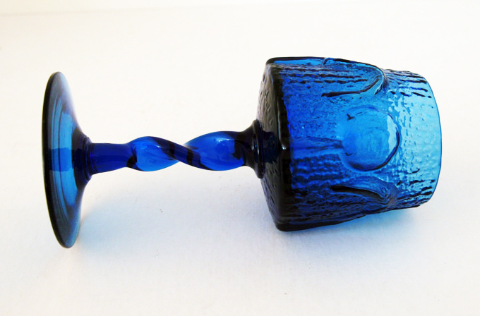 The pattern is called "Antiqua" and and appealed to the popular Medieval decor rage of the early 1960's.