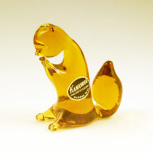 Cute nut-munching vintage art glass squirrel with original label.