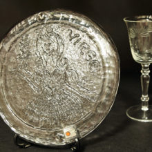 he intaglio decor was impressed on the glass by the mold. The lines are raised up from the surface creating texture.