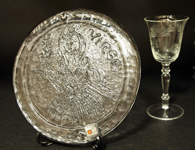 he intaglio decor was impressed on the glass by the mold. The lines are raised up from the surface creating texture.