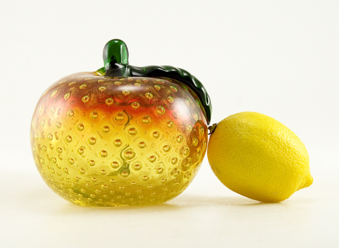 Stunning three pound ruby and uranium glass art peach figurine. This absolutely beautiful vintage sommerso glass peach with hand-blown quality glass. The peach is blown hollow with heavy, very thick walls. The ample emerald green stem and leaf were tooled separately and applied to the peach.