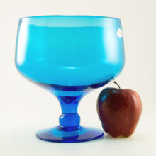 Hand blown with soft pontil mark and applied foot.