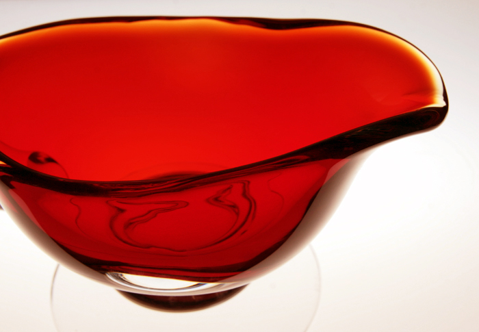 The vessel was hand-blown from mold and hand-tooled at the spout. The foot is supported by a large wafer (Dover).