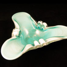 This lovely tripod shaped glass ashtray was hand blown with three layers of clear, milk and turquoise glass decorated with specks of swirled platinum aventurine.