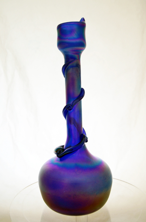 This beautiful aurene style bottle was used to serve rose water, a standard condiment on Middle-Eastern tables.