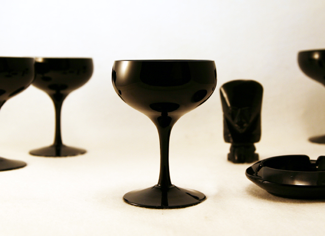 Set of 4 Mid-Century Modern opaque black blown glass saucer champagne set. This shape is usually referred to as "saucer champagne", and can be used as cocktails glasses or compotes. Beautiful, modernistic and versatile vintage glass. Color and style was popular during the mid-century Swedish Modern craze. Suspect maker is Tiffin or Duncan Miller. No maker's mark.