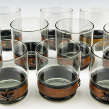 Pristine leather trimmed double rocks bar glass set.