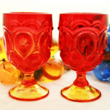 The beautiful amberina glass of the Moon and Star goblets gradually blends in ruby red and yellow.