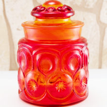 Lovely quarter gallon Moon and Star canister jar in dark tangerine. Made by LE Smith, circa 1930s - 1940s.
