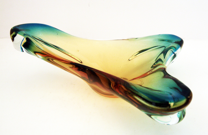 Hand-formed glass is peppered with tiny air bubbles and one inclusion, this is common on vintage blown glass.