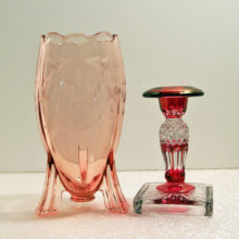 Thick pink depression glass with a deco atomic rocket decor.