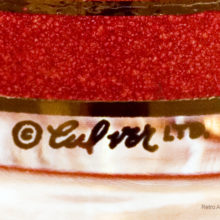 They were decorated by hand, hence the décor misses here and there. Notice how the dark red textured enamel is not perfectly bordered by the gold band above the signature.
