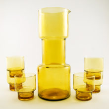Funky barbell shaped carafe and six double shot glasses.