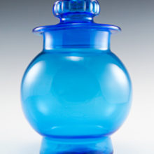 Beautiful retro vintage kitchen glass canister in vivid blue.