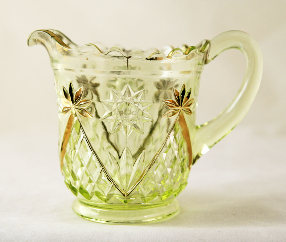 Made in heavy uranium glass (Vaseline glass) with a four part mold. The glass is a light yellowish green. Rare as a set. Rare as gilded Vaseline glass.