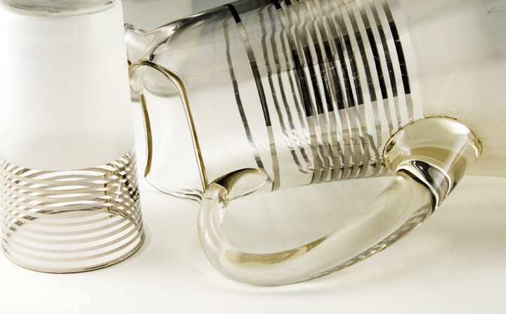 Large pitcher is blown from optic mold (no seams) and hand tooled with applied solid glass handle.