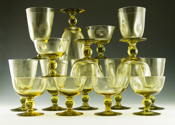 16 piece set of mid-century era pinch goblets in chartreuse, a lemony olive green.