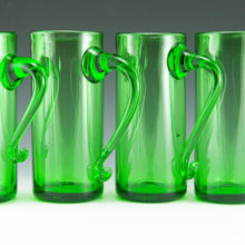 Tall hand-blown bar glass mugs in grass green.