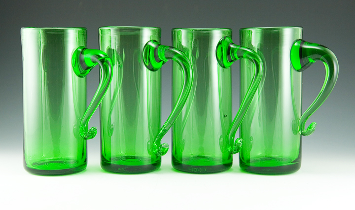 Tall hand-blown bar glass mugs in grass green.