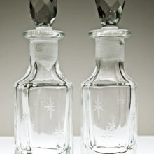 Pair of very old, very well-cared for jewel stoppered glass star bottles.