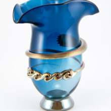 Mouth-blown art glass vase with Mercury glass garland decor.