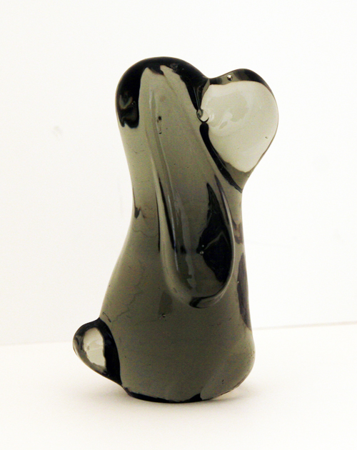 Cute hand formed solid glass pooch.