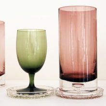 Heavy solid clear glass bases with a suspended bubble.