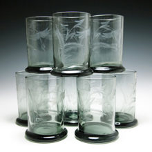 Smoke black glass with a hint of moss green, blown and etched.